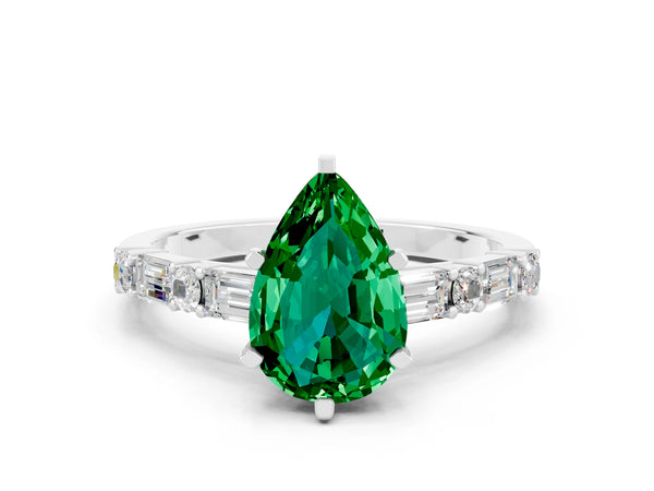 White gold Pear Cut Emerald Solitaire with Side Baguettes and Channel Set Band