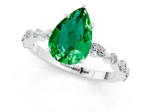White gold Pear Cut Emerald Solitaire with Side Stones on a Pavé Band and Four-Prong Setting_1