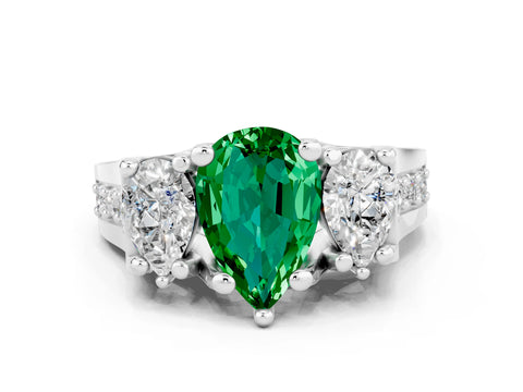 White gold Pear Cut Emerald Three-Stone Ring with Channel Set Band and Four-Prong Setting