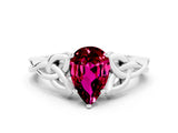 White gold Pear Cut Garnet Solitaire Engagement Ring with Celtic Knot Band and Four-Prong Setting