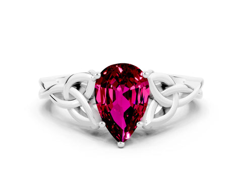 White gold Pear Cut Garnet Solitaire Engagement Ring with Celtic Knot Band and Four-Prong Setting