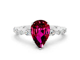 White gold Pear Cut Garnet Solitaire with Side Stones on a Pavé Band and Four-Prong Setting