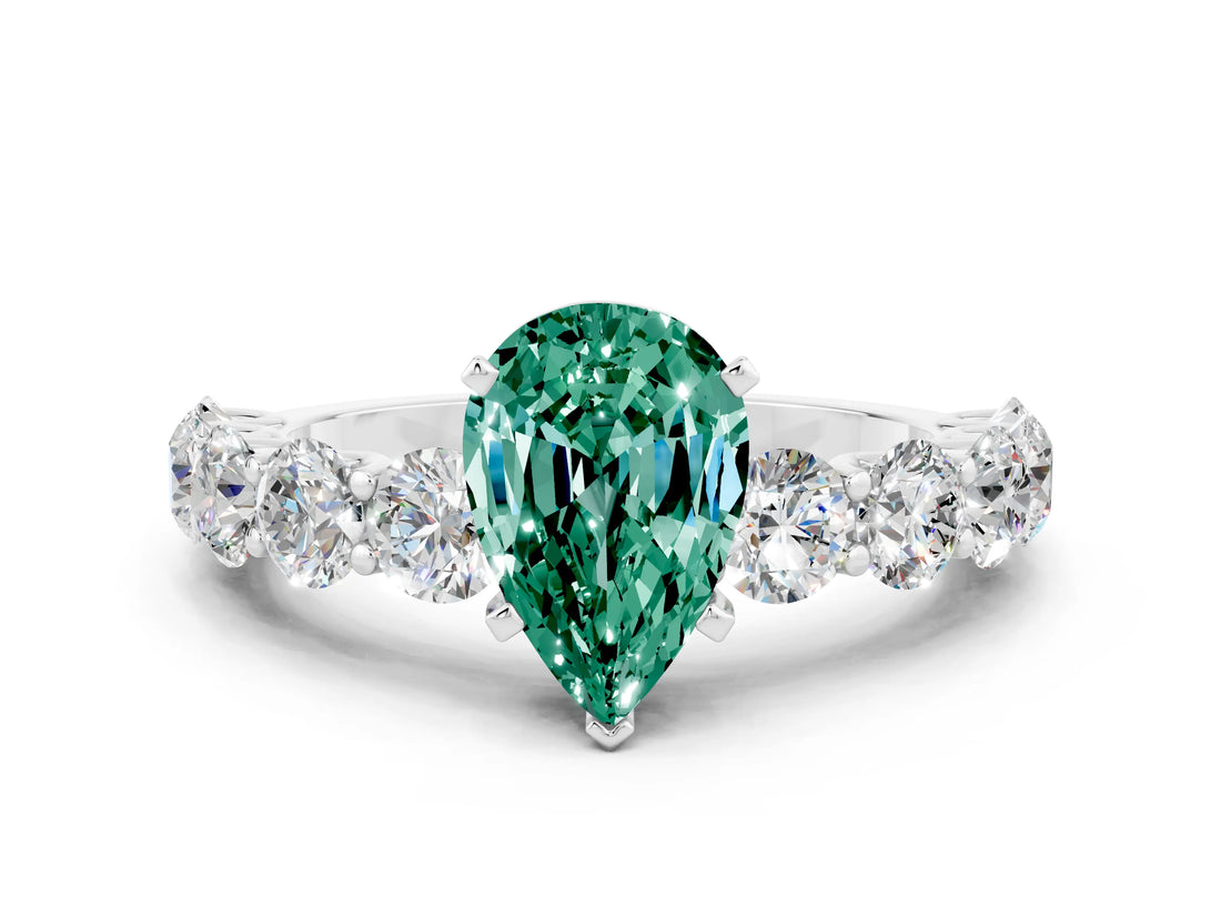 White gold Pear Cut Green Sapphire Prong Setting with Side Stones on a Pave Band