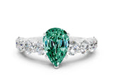 White gold Pear Cut Green Sapphire Prong Setting with Side Stones on a Pave Band