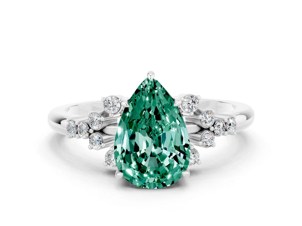 Silver Pear Cut Green Sapphire Ring with Side Stones and Four-Prong Setting
