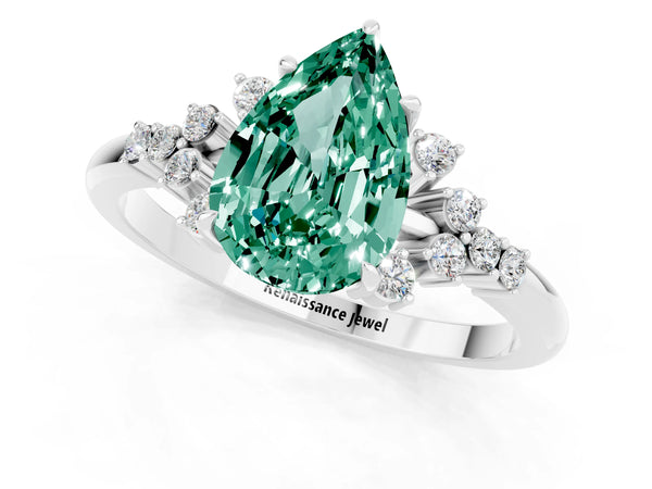 Platinum Pear Cut Green Sapphire Ring with Side Stones and Four-Prong Setting