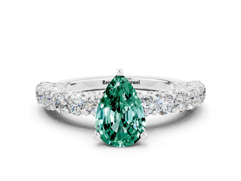 White gold Pear Cut Green Sapphire Solitaire Ring with Shared Prong Pavé Band and Four-Prong Setting