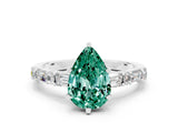 White gold Pear Cut Green Sapphire Solitaire with Side Baguettes and Channel Set Band