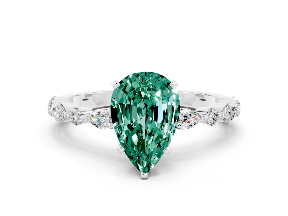 White gold Pear Cut Green Sapphire Solitaire with Side Stones on a Pavé Band and Four-Prong Setting