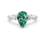 White gold Pear Cut Green Sapphire Solitaire with Side Stones on a Pavé Band and Four-Prong Setting