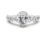 White gold Pear Cut Moissanite Prong Setting with Side Stones on a Pave Band
