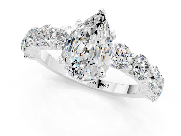 Silver Pear Cut Moissanite Prong Setting with Side Stones on a Pave Band