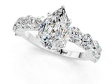 White gold Pear Cut Moissanite Prong Setting with Side Stones on a Pave Band_1