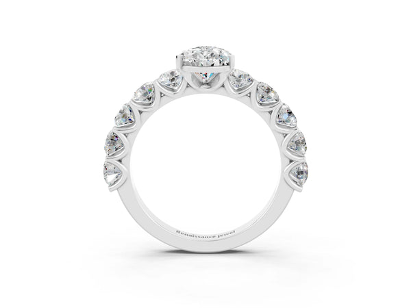 White gold Pear Cut Moissanite Prong Setting with Side Stones on a Pave Band