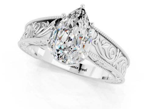 White gold Pear Cut Moissanite Solitaire Ring with Engraved Band and Four-Prong Setting_1