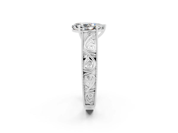 Platinum Pear Cut Moissanite Solitaire Ring with Engraved Band and Four-Prong Setting