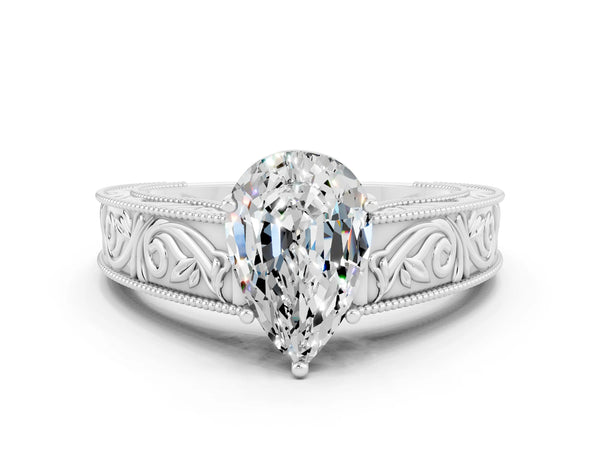 White gold Pear Cut Moissanite Solitaire Ring with Engraved Band and Four-Prong Setting
