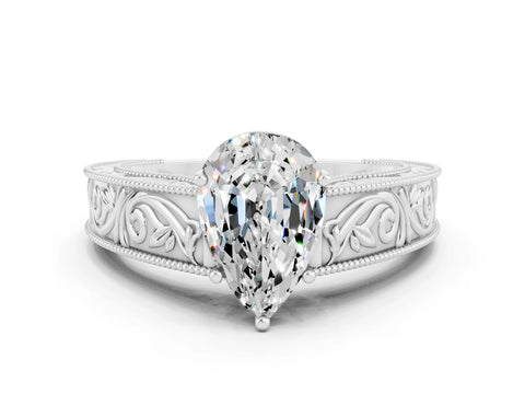 White gold Pear Cut Moissanite Solitaire Ring with Engraved Band and Four-Prong Setting