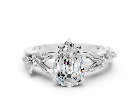 White gold Pear Cut Moissanite Solitaire Ring with Leaf Motif Band and Four-Prong Setting