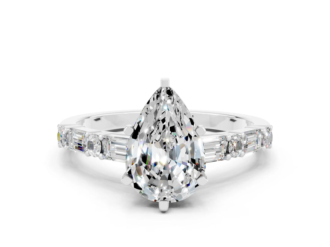White gold Pear Cut Moissanite Solitaire with Side Baguettes and Channel Set Band
