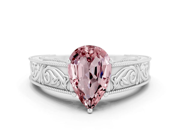 Platinum Pear Cut Morganite Solitaire Ring with Engraved Band and Four-Prong Setting