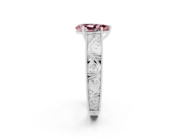 Platinum Pear Cut Morganite Solitaire Ring with Engraved Band and Four-Prong Setting