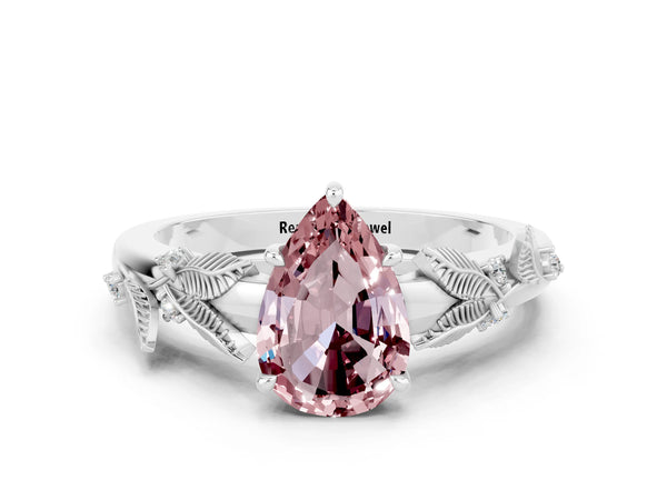 Platinum Pear Cut Morganite Solitaire Ring with Leaf Motif Band and Four-Prong Setting