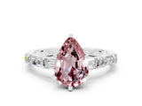 White gold Pear Cut Morganite Solitaire with Side Baguettes and Channel Set Band