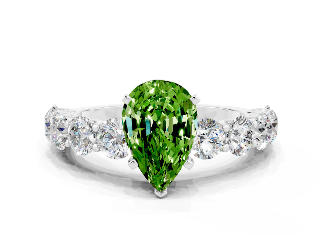 White gold Pear Cut Peridot Prong Setting with Side Stones on a Pave Band