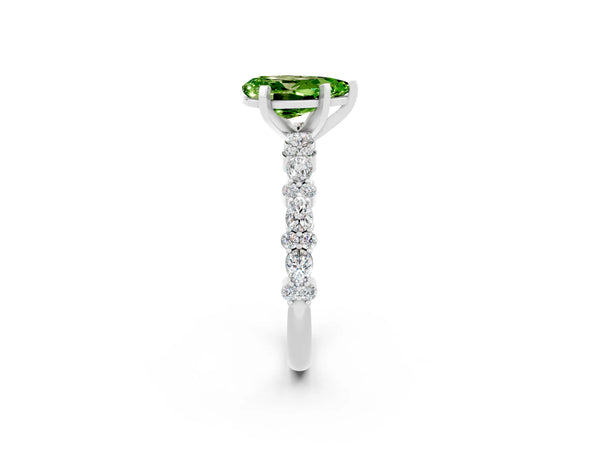 Platinum Pear Cut Peridot Side Stone Solitaire Ring with Round  and Four-Prong Setting