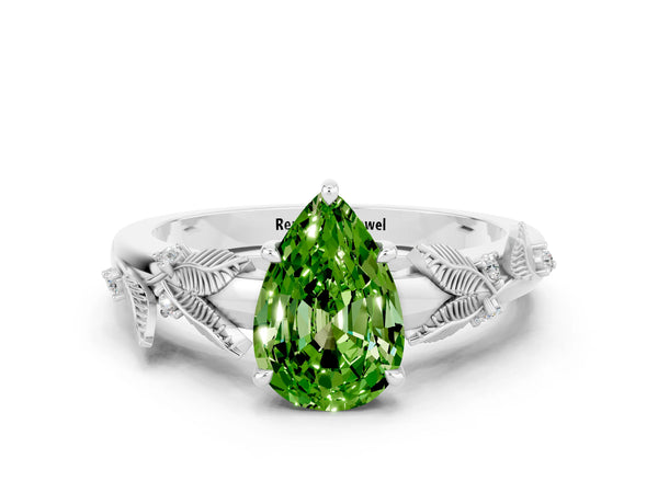 Silver Pear Cut Peridot Solitaire Ring with Leaf Motif Band and Four-Prong Setting