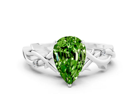 White gold Pear Cut Peridot Solitaire Ring with Twisted Band and Prong Setting