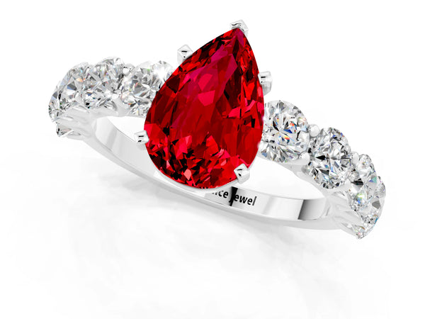 Silver Pear Cut Ruby Prong Setting with Side Stones on a Pave Band