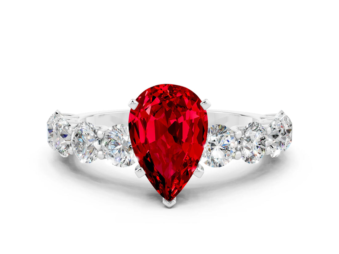 White gold Pear Cut Ruby Prong Setting with Side Stones on a Pave Band