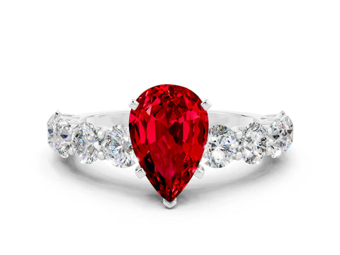 White gold Pear Cut Ruby Prong Setting with Side Stones on a Pave Band