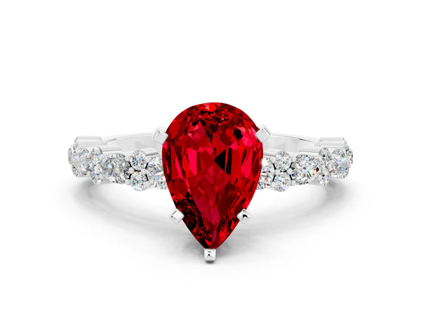 Platinum Pear Cut Ruby Side Stone Solitaire Ring with Round  and Four-Prong Setting