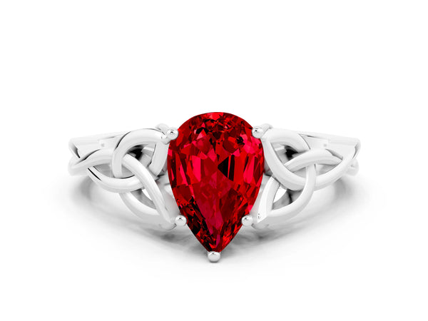 White gold Pear Cut Ruby Solitaire Celtic Knot Ring with Four-Prong Setting