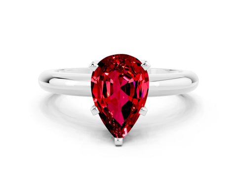 White gold Pear Cut Ruby Solitaire Engagement Ring with Round Band and Four-Prong Setting