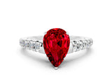 White gold Pear Cut Ruby Solitaire Ring with Cathedral Setting and Pavé Band