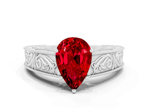 White gold Pear Cut Ruby Solitaire Ring with Engraved Band and Four-Prong Setting
