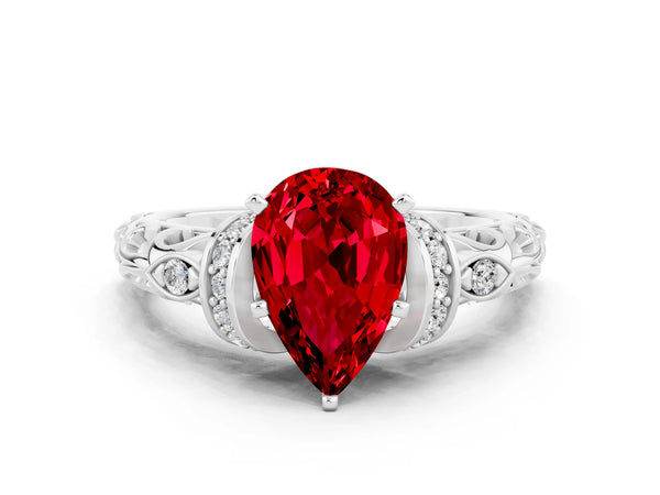 White gold Pear Cut Ruby Solitaire Ring with Filigree Band and Four-Prong Setting