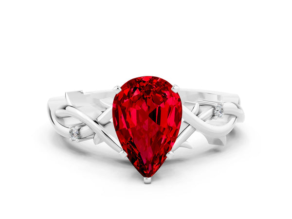 Silver Pear Cut Ruby Solitaire Ring with Twisted Band and Prong Setting