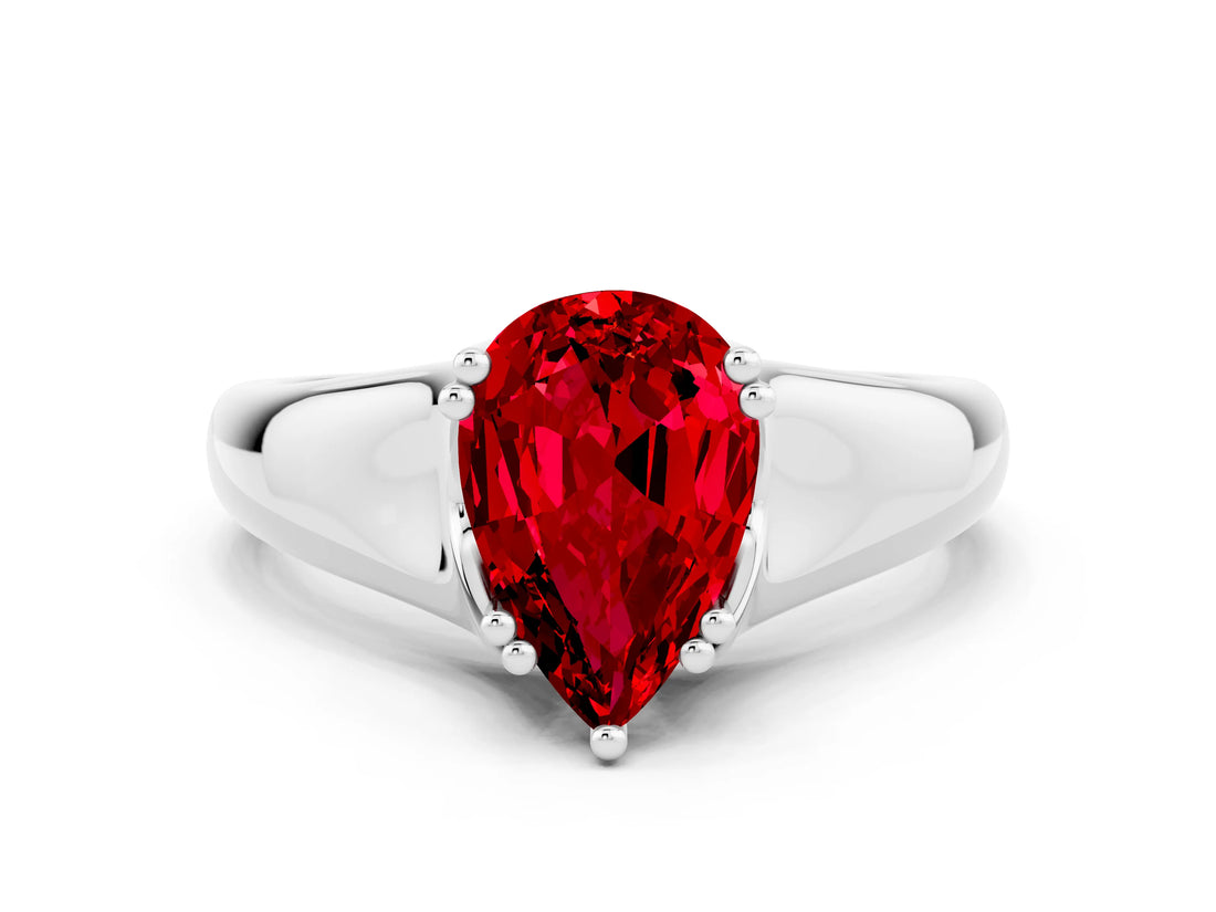 White gold Pear Cut Ruby Solitaire Ring with Wide Band and Prong Setting