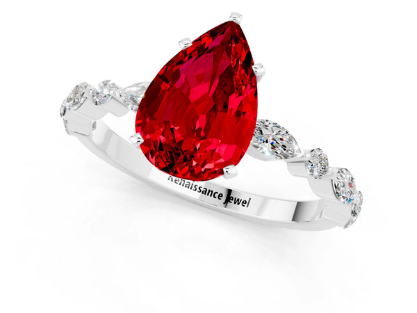 White gold Pear Cut Ruby Ring with Marquise and Round  Side Stones and Four-Prong Setting