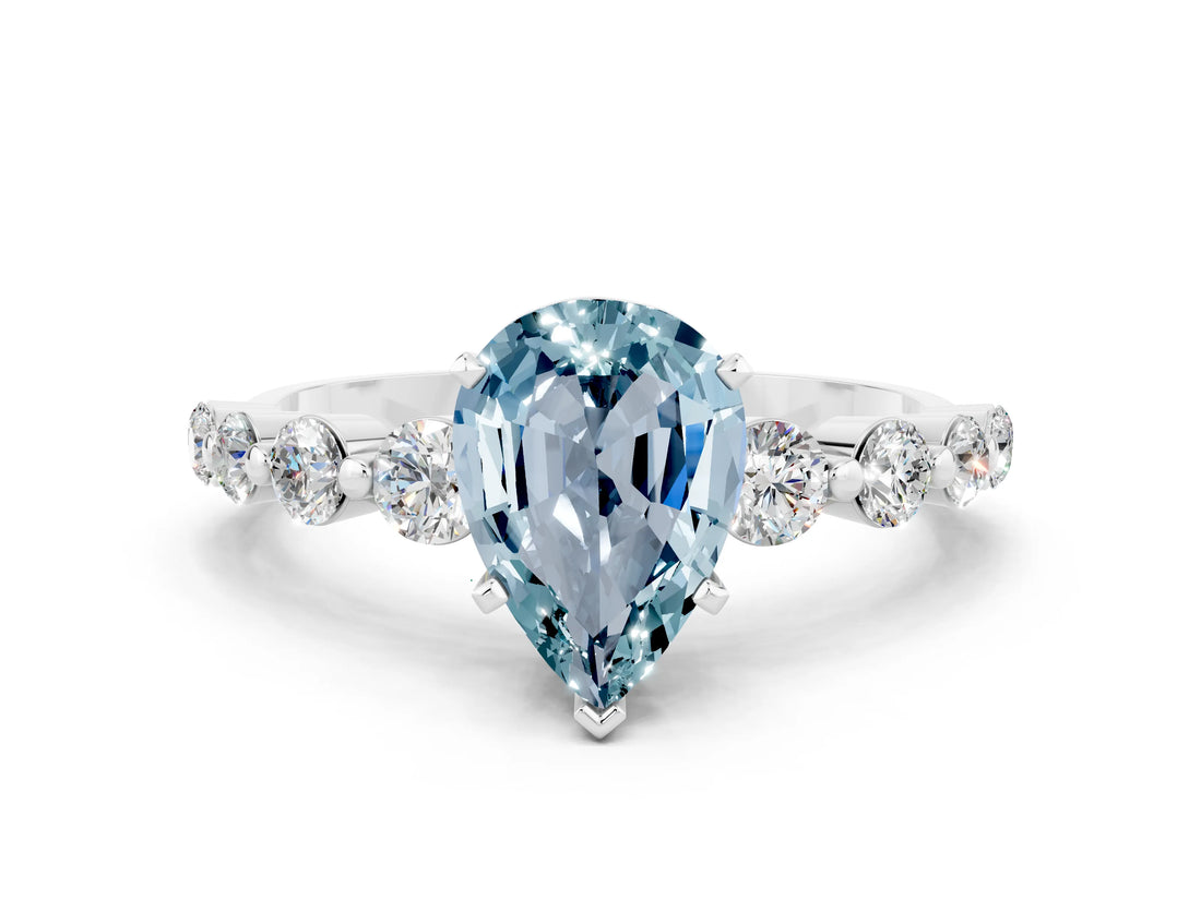 White gold Pear Cut Solitaire Aquamarine Ring with Pave Band and Four-Prong Setting