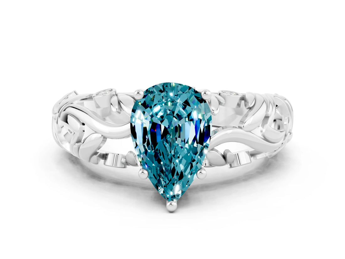 White gold Pear Cut Solitaire Blue Topaz Leaf-Inspired Vine Band Ring with Prong Setting
