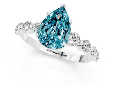 White gold Pear Cut Solitaire Blue Topaz Ring with Pave Band and Four-Prong Setting_1