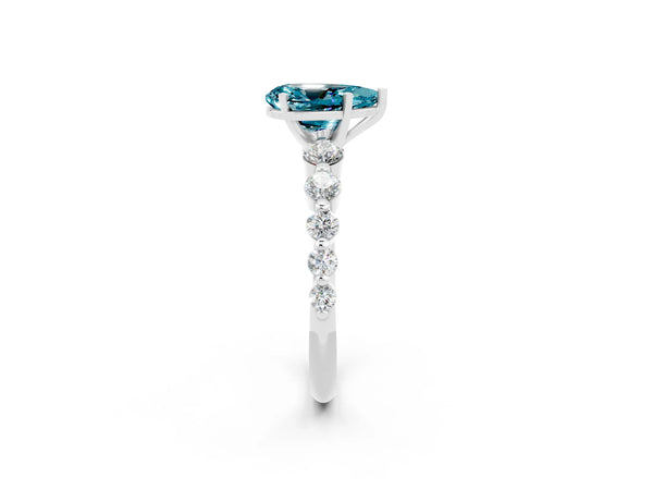 Silver Pear Cut Solitaire Blue Topaz Ring with Pave Band and Four-Prong Setting