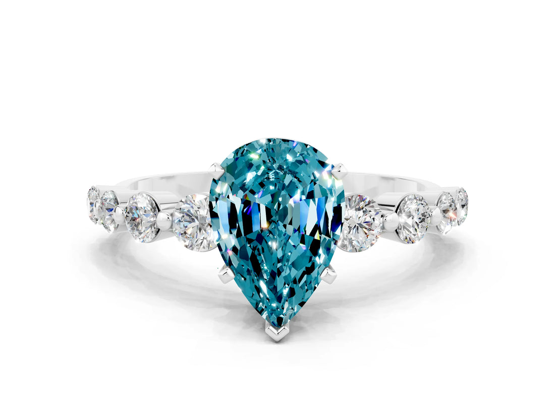 White gold Pear Cut Solitaire Blue Topaz Ring with Pave Band and Four-Prong Setting