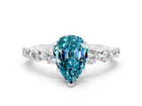 White gold Pear Cut Solitaire Blue Topaz Ring with Pave Band and Four-Prong Setting
